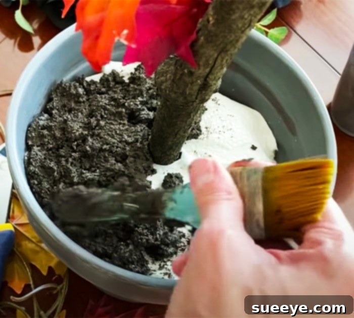 Transforming Branches into Autumn 3 Finishing Touches: Applying Realistic Soil Base to Your DIY Fall Tree with Mod Podge