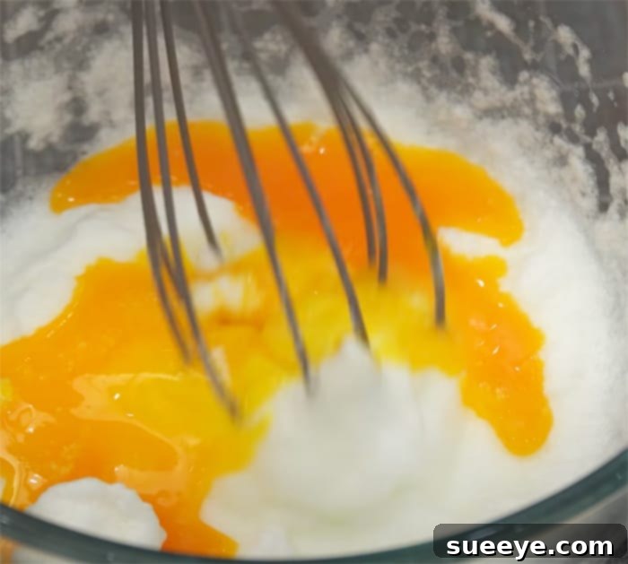 Cloud-Like Souffle Omelette 2 Whisk Egg Whites To Make Fluffy Souffle Omelette - Fluffy Egg Recipes - Nino's Home Recipes