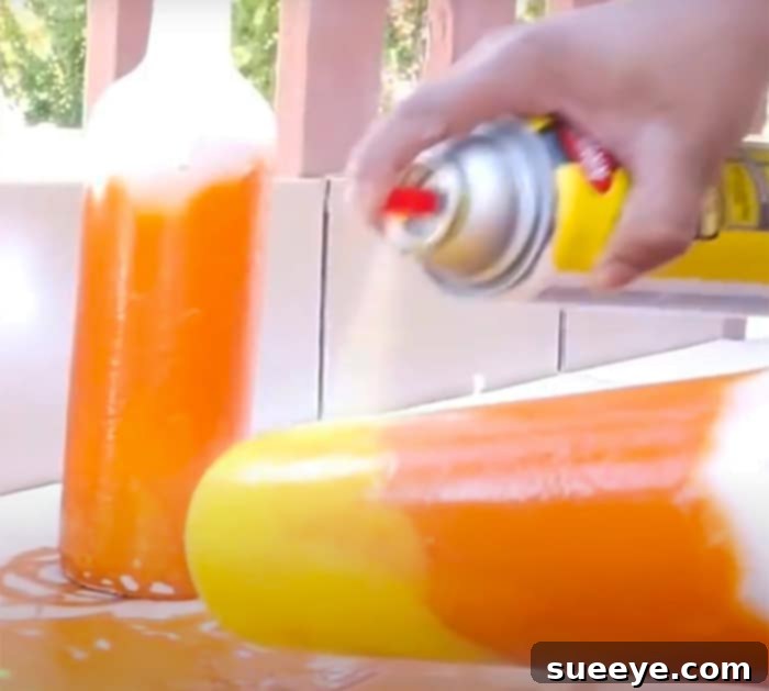 Autumnal Halloween Wine Bottle Decor 3 Spray Paint Wine Bottles To Make Candy Corn Decor - DIY Halloween Decor - DIY Candy Corn Ideas