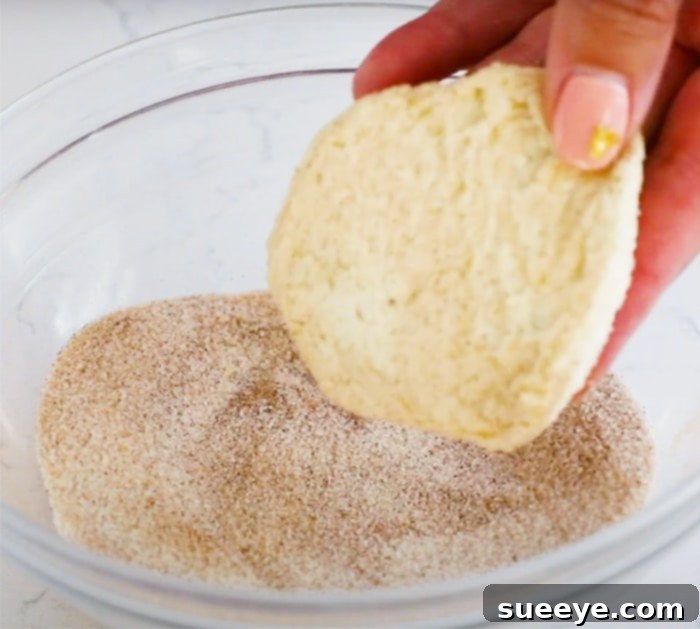 How To Make Pumpkin Pull Apart Bread - Pumpkin Recipes showcasing the layered pumpkin biscuit dough before baking.
