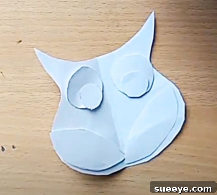 Crafting Adorable Felt Owl Fridge Magnets 2 Step-by-step guide to drawing and cutting your owl pattern for a felt refrigerator magnet project. Learn easy fridge magnet patterns for DIY ideas.