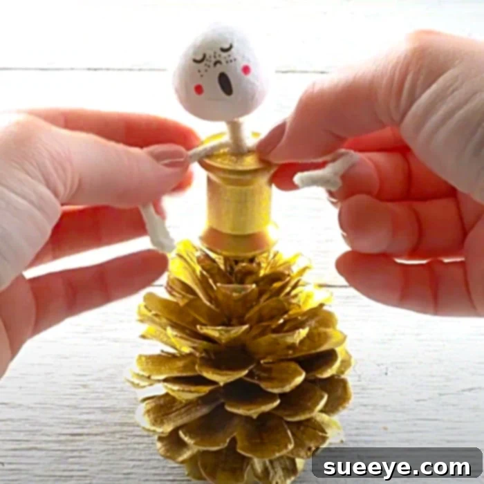 DIY Pinecone Carolers: Adorable handmade Christmas decorations crafted from natural pinecones and felt.