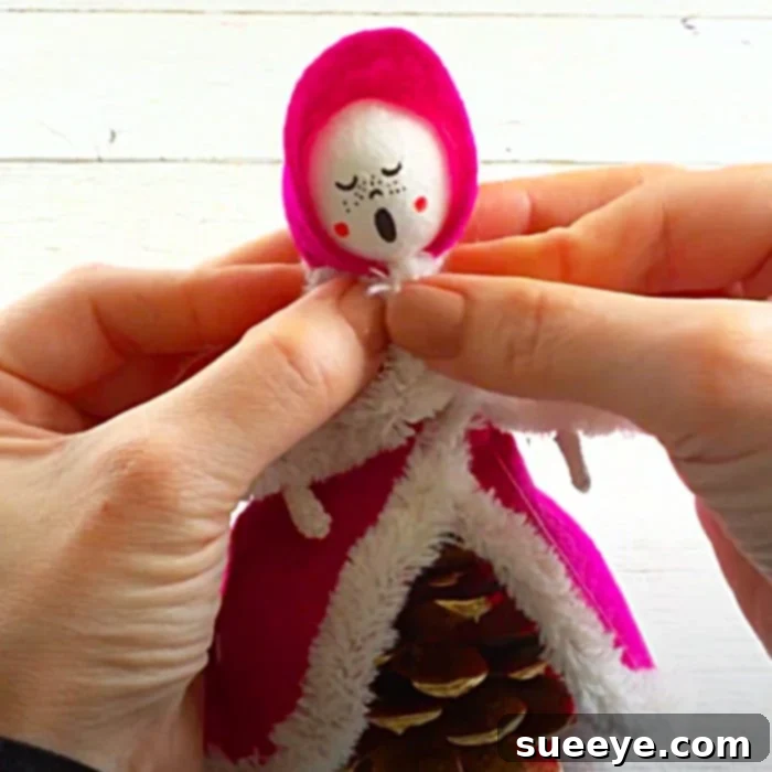 How to make pinecone carolers for DIY Christmas decor and festive holiday crafts.
