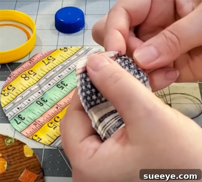 Upcycled Cap Pin Keeper 2 How To Make Bottle Cap Pin Cushion - Bottle Cap Crafts - Upcycled Crafts and Projects