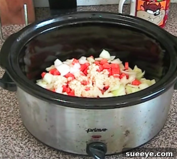 Effortless Slow Cooker Winter Vegetable Soup 2 Delicious homemade winter vegetable soup prepared in a slow cooker, featuring a hearty mix of vegetables and grains.