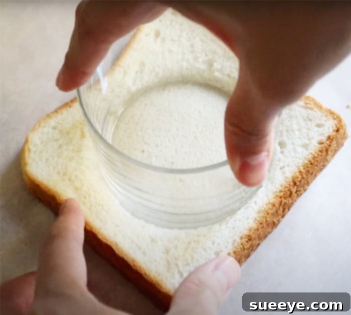 Air Fryer Loaded Breakfast Toast 2 Preparing bread for cheese egg bacon toast, showing a circular indentation